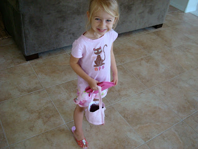 Young girl walking around in heels with purse and handbag