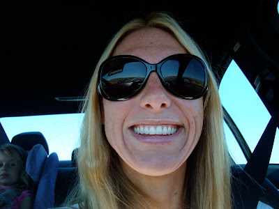 Woman with sun glasses on smiling