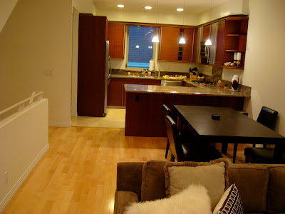 View from living room into dining room and kitchen - 3