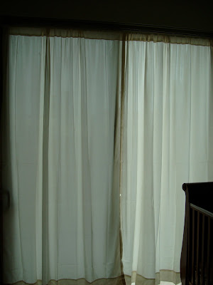 Curtains on windows in room