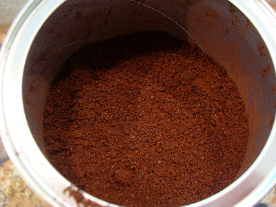Inside container of coffee showing grounds