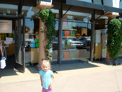 Girl standing in front of Crate & Barrel store