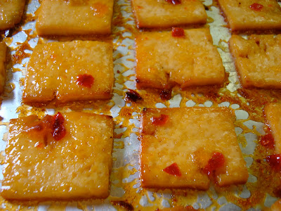 Close up of flipped tofu in oven