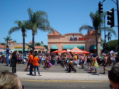 People walking down street during Gay Pride Parade