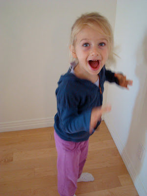 Young girl doing a scary monster face