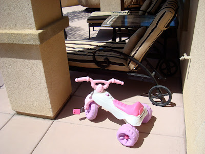Pink and white pedal scooter