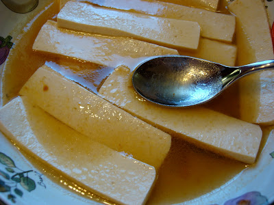 Close up of sliced tofu in marinade