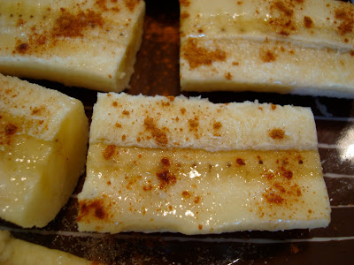 Warm Cinnamon Sugar Bananas close up on brown plate