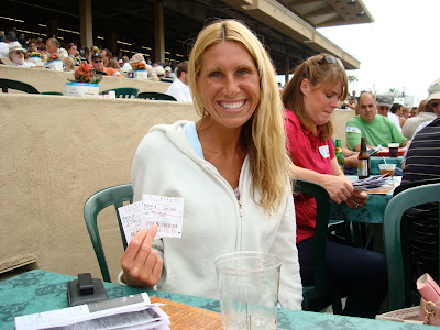 Woman sitting holding two track tickets