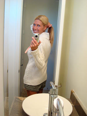 Woman showing backside of sweater - 25