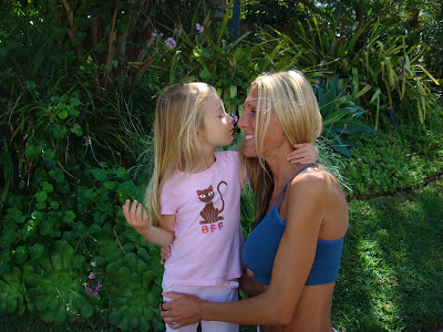 Close up of child doing a kissing face at woman - 27