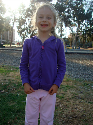 Young girl standing at park smiling - 15