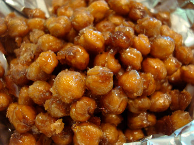 Close up of Carmelized Cinnamon Sugar Roasted Chickpea "Peanuts" in lined pan