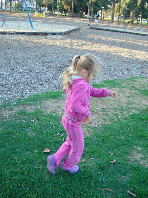 Side of young girl at park running