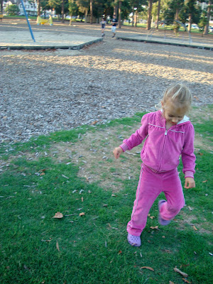 Young girl running while looking at ground