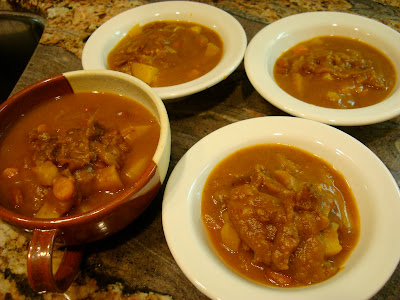 Savory Pumpkin, Potato, and Carrot Soup portioned into four bowls
