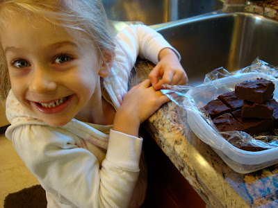 Young girl smiling in front of Chocolate Peanut Butter Fudge