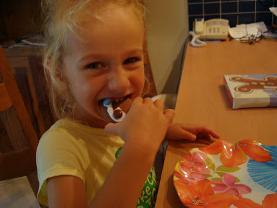 Young girl eating portion of gingerbread man