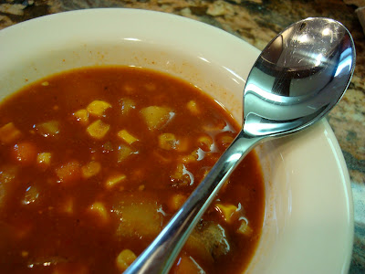 Spicy Vegetable, Corn, & Bean Soup close up in bowl with spoon