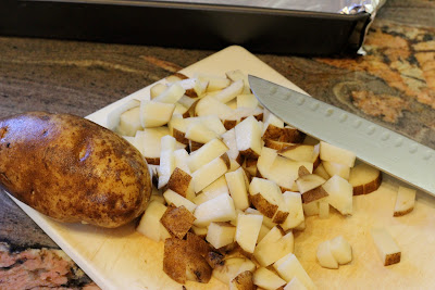 Dicing potatoes on cutting board