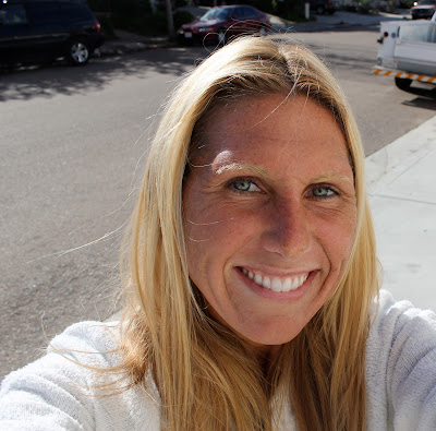 Close up of woman smiling on sidewalk