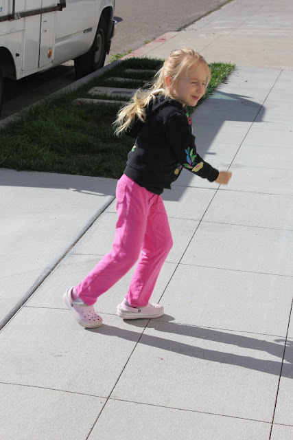 Young girl running on sidewalk - 57