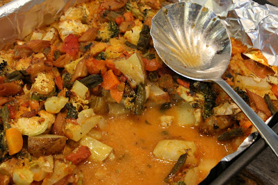 Spoon scooping out some Cheezy Vegetable Bake - 17