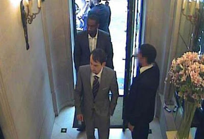 An image from CCTV footage of two smartly-dressed armed robbers entering Graff Jewellers in London's West End