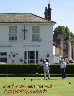 Bowling in front of the Cricketers pub
