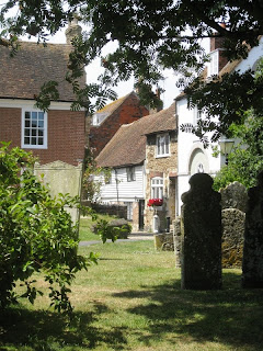 View of tombstones and houses from Rye church