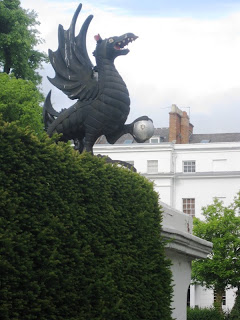 Black Griffin with open mouth on a pillar in Leamington Spa