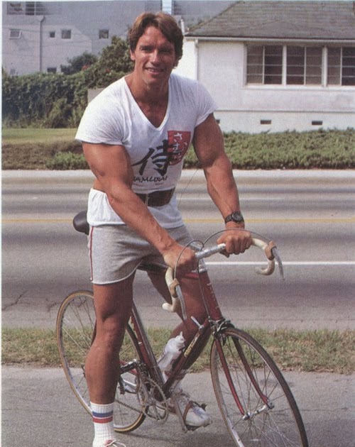 arnold schwarzenegger riding a bike