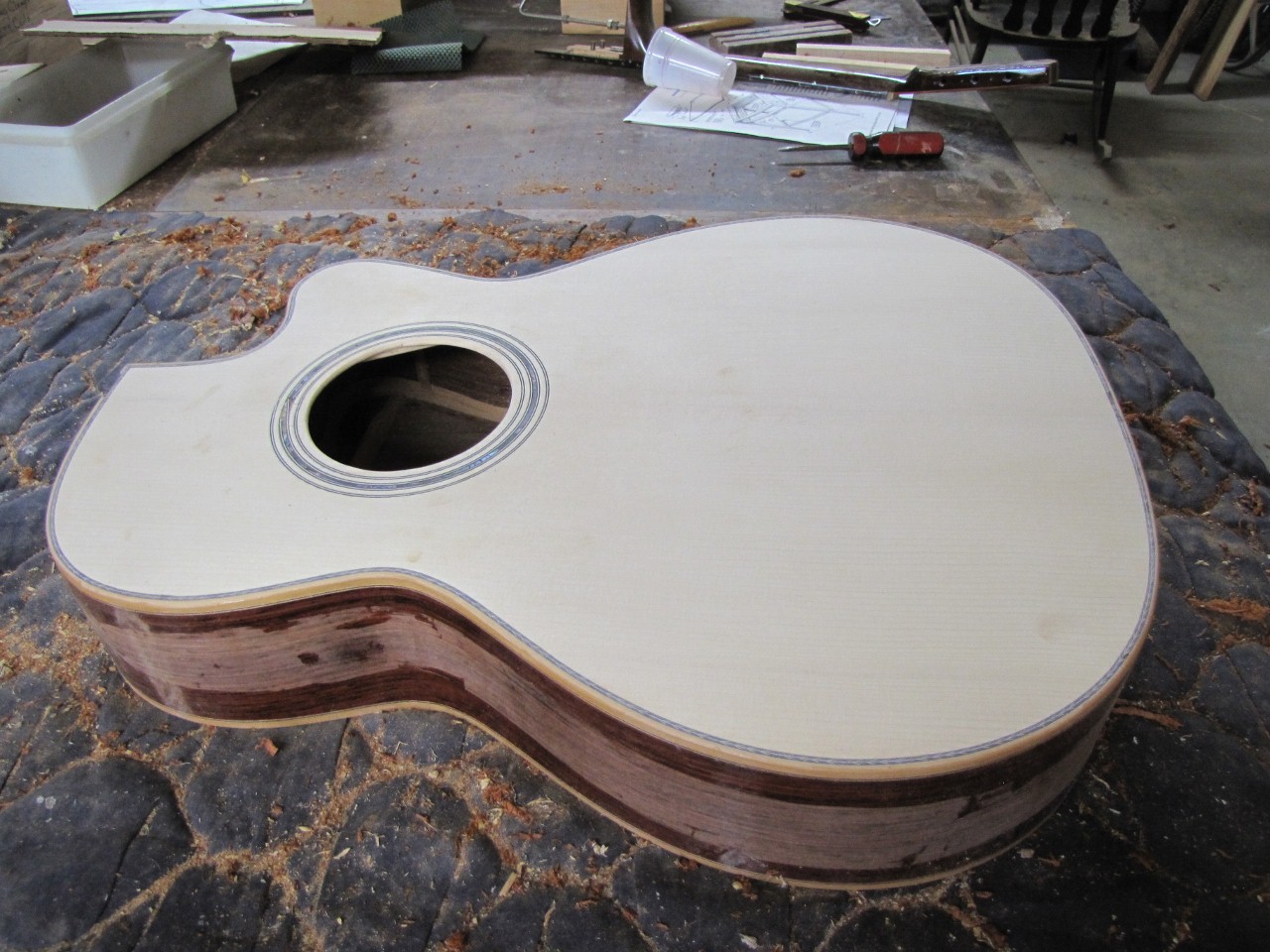 Kinnaird Guitars in the mountains adding a top and installing binding