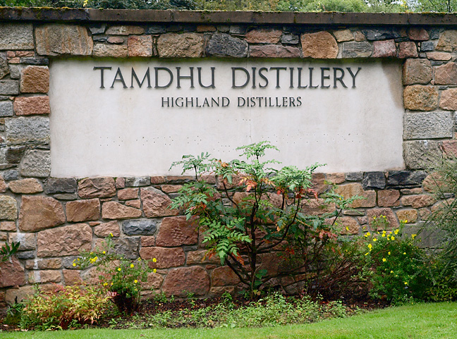 sign in a stone wall at Tamhdu Distillery