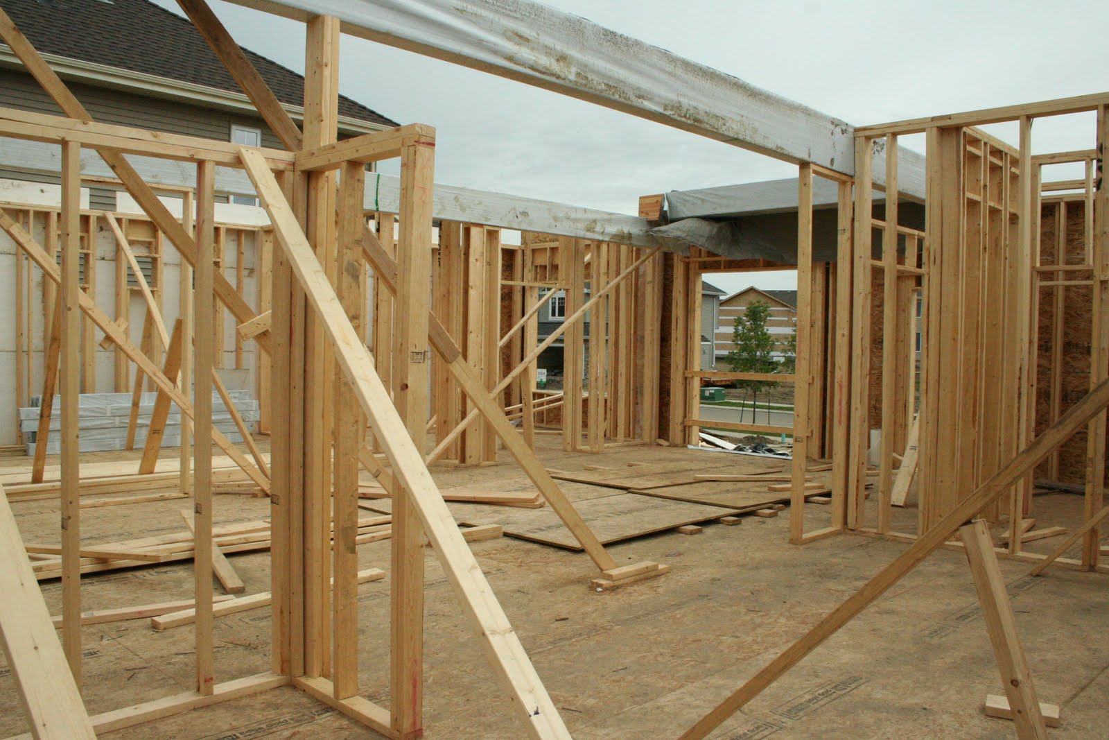 Building our 2nd House Lumber piles smaller