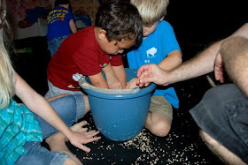 fall party game hide pennies in corn cob filled bucket