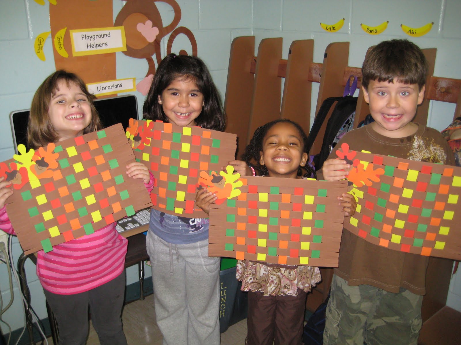 First Grade with Mrs. Ledford and Mrs. Vaillette Making Placemats