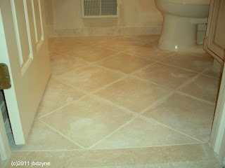 new ceramic tile bathroom floor in diagonal 12 by 12's