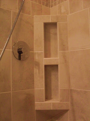 tan tile inside-corner niche for shampoo