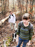 male, female, and border collie dog, hiking on a hiking trail