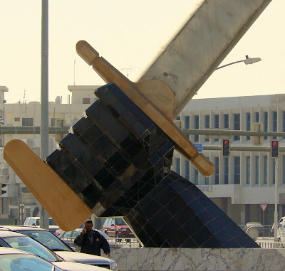  A giant hand clutches the hilt of a sword in Grand Hamad Street