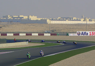 Bikes round the final corner of Losail International Racing Track