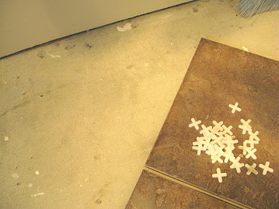 How I tiled my entryway myself with a custom cut pattern using a wet saw tile cutter.