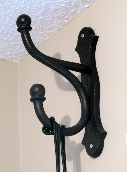 Oversized black rustic hook for hanging in a bedroom | funkyjunkinteriors.net