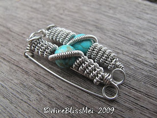 two identical wire wrapped brooch