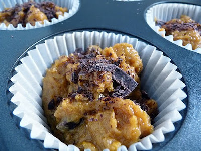 Chocolate chip pumpkin muffin batter in muffin liners. 