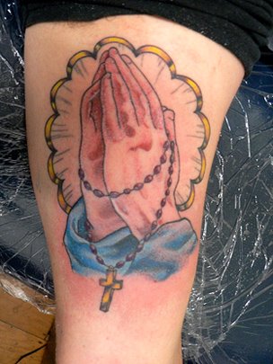 To me, this tattoo of praying hands is a reminder of humbleness and a