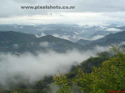 mountain ranges covered in mist in the valley a landscape scenery on the way to munnar hill station kerala