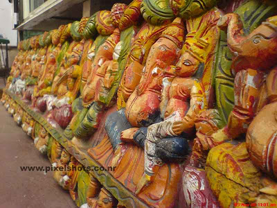 clay sculpture of ganesha the hindu god from sculpture and antiques shop in old jewstreet of cochin india kerala,clay sculptures,kaliman prathimakal,clay sculpture painting,sculptures for sale in cochin-kerala,street sculpture shop,ganesha and other gods