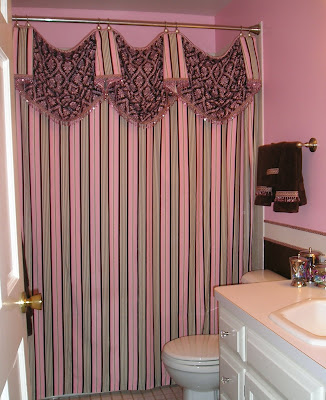 custom striped curtain in the bathroom in a a prettied up bathroom makeover